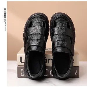 Detail of black leather men's sandals featuring breathable cut-outs and velcro straps