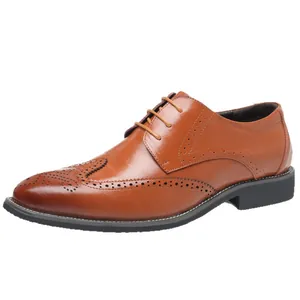 Classic brown Brogue leather shoes for men featuring intricate wingtip carving details