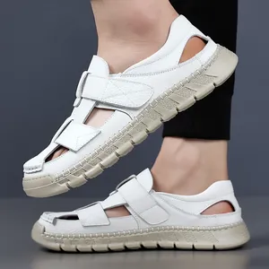 Men's white leather hollow out sandals with Velcro straps on models feet