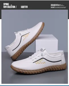Detail of white leather loafer featuring yellow stitching and grippy gum rubber sole