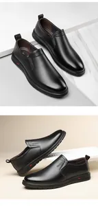 Close-up of black leather slip-on loafers with elastic sides and stitched details