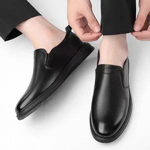 Men's premium black leather slip-on shoes with elegant brand embossing and soft sole
