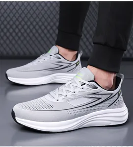 Detail showing breathable grey mesh upper and shock-absorbing wavy sole of men's running shoe