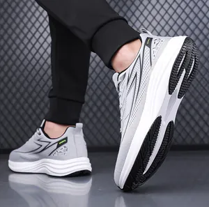 Detail view of lightweight gray knit running shoe with white anti-slip thick sole