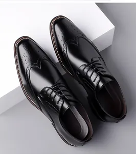 Detailed close-up of classic black brogue wingtip shoes with intricate perforated details