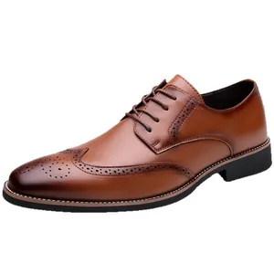 Classic brown brogue dress shoes with wingtip detailing and a polished gradient finish