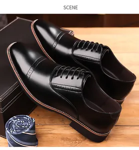 Macro shot of black wingtip brogue dress shoes with classic cap-toe and hole patterns