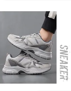 Macro side view of breathable grey mesh running shoes with Fashion Sport text