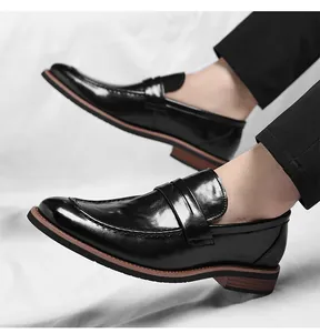Dynamic side view of men's black patent leather penny loafers with classic wood grain sole