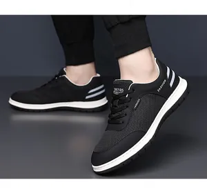 Detail of breathable mesh upper and Fashion lettering on black casual men sneakers