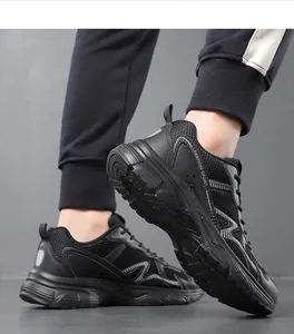 Detailed close-up of breathable mesh upper and durable thick sole on black sports shoes