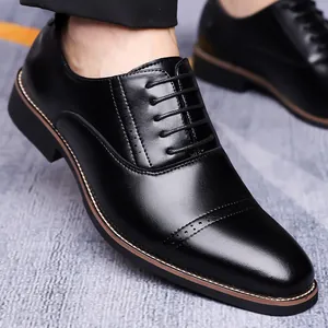 Men's black pointed-toe brogue derby shoes with polished leather and lace-up design
