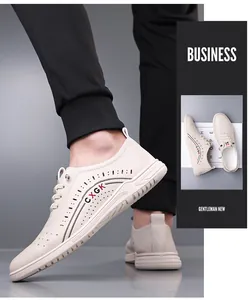 Macro detail of breathable perforated leather upper on casual cream business men shoes