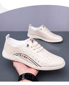 Detail showing breathable hollow-out design and CXGK logo on beige casual leather shoes
