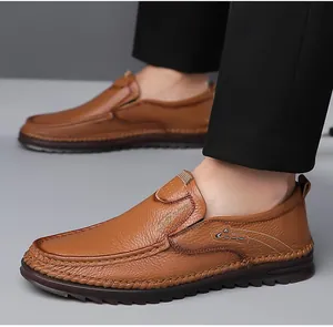 Detail view of brown leather loafers featuring pebble grain texture and fashion buckle