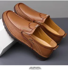 Close-up of caramel brown leather loafers with lychee texture and fine hand-stitched detail