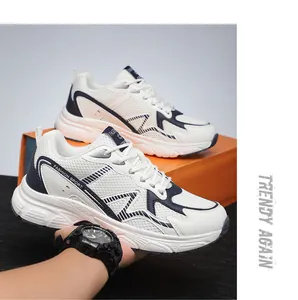 Detailed side view of white mesh and navy synthetic leather fashion sport sneakers