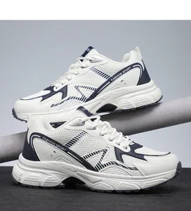 Close-up of white and blue mesh sneakers on a grey display stand showing breathable texture