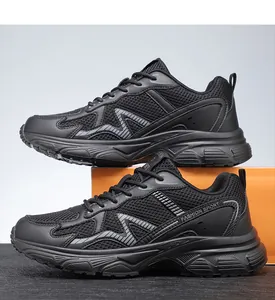 Detail view of breathable black mesh men's sneakers featuring Fashion Sport logo lettering
