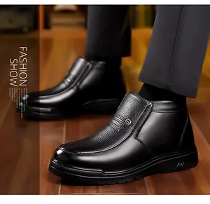 Close-up of black men's winter leather boots featuring textured lychee grain and non-slip soles