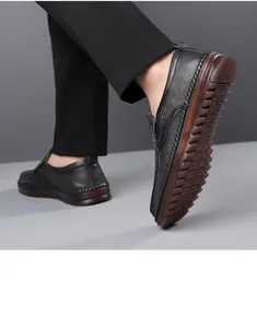 Detail view of men's genuine leather loafers featuring pebble grain texture and non-slip sole