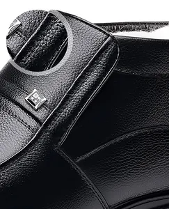 Macro detail of black litchi grain leather and warm white faux fur lining for winter boots