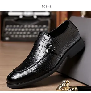 Detail of black faux crocodile leather business shoes with elegant side buckle closure