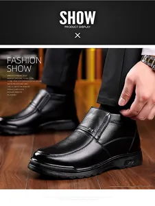 Detail of premium lychee-grain black leather winter boots for men with warm lining