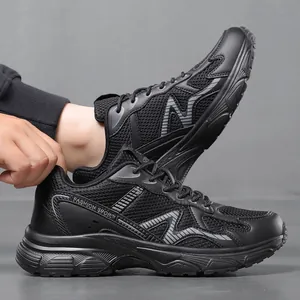 Lightweight breathable black mesh sneakers with cushioned sole for athletic casual wear