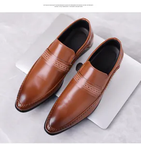 Macro detail of brown embossed leather business shoes with geometric pattern strap