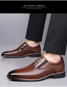 Detail of brown embossed leather business shoes with gradient toe and elastic side