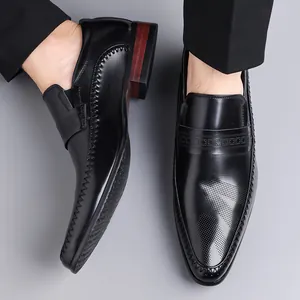 Men's black leather formal dress loafers with perforated details and stylish wood grain heel