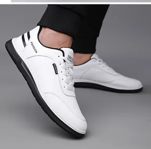 Detail of white leather men sneakers showing fashion stripes and breathable side perforations