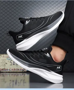 Close-up of black breathable mesh sneakers with chunky white sole and logo detail
