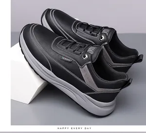 Detail of black pebbled leather texture and white double stitching on men sneakers