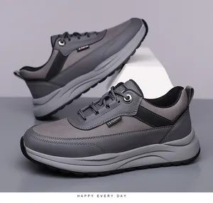 Close-up of men's casual sneakers featuring grey layered textures and FASHION label