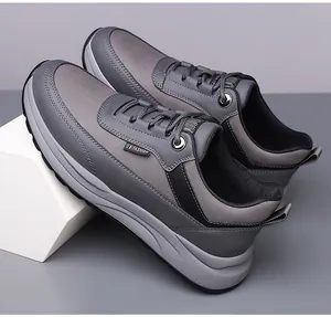 Detail view of men's casual sneaker featuring grey fabric layers and Fashion side label