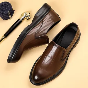 Brown crocodile-textured leather loafers for men featuring a stylish gradient finish