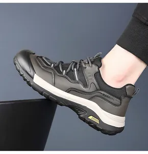 Side view of men's athletic outdoor shoe with durable non-slip thick sole and mesh details