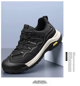 Close-up of durable black mesh and leather patchwork design on athletic work shoes