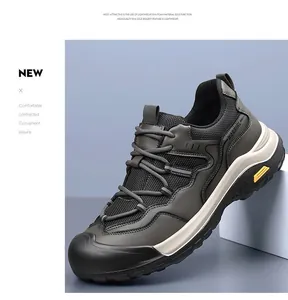 Close-up of lightweight dark grey men's sneakers with breathable mesh and thick white EVA soles