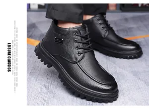 Detail of men's black leather casual boot showing pebble grain texture and lugged sole