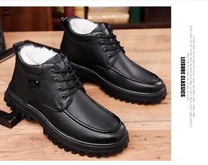 Detail of men's black winter boots with warm faux fur lining and non-slip thick rubber sole