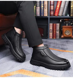 Detail view of black leather winter boots featuring side zipper and thick non-slip rubber sole