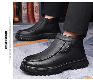 Close-up of black leather boots with metal buckle and non-slip thick rubber sole