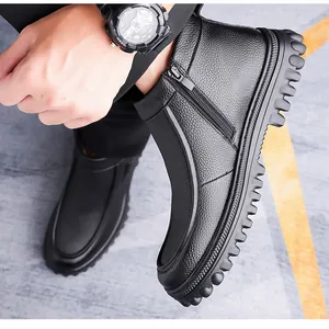 Detail of black textured leather boots featuring side zipper and thick non-slip sole