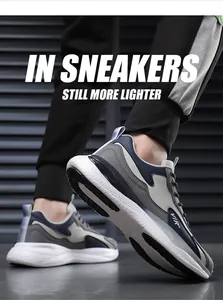 Detaillierte Seitenansicht stylischer Herren-Sneaker in Grau-Blau mit hochwertigem Leder