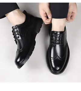 Detailed close-up of men's black Brogue shoes featuring classic wingtip carving and laces