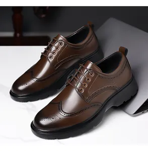 Detail shot of brown wingtip brogue shoes with decorative perforations and thick sole