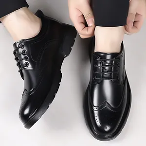 Classic black Brogue dress shoes for men featuring wingtip carving and polished finish